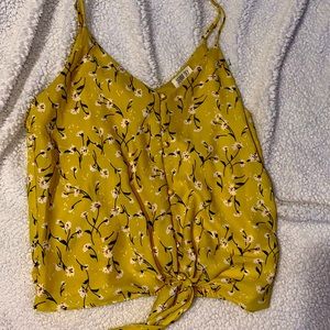 Size S mustard yellow and floral tank top w front tie and buttons. Never worn